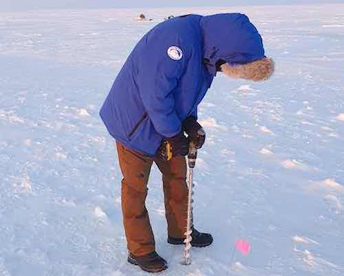 Fonger drilling an ice core